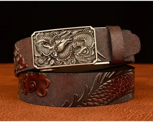 Detailed view of men's leather belt with dragon embossed pattern and metal automatic buckle.