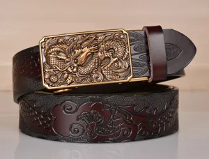 Detailed view of men's leather belt with embossed dragon pattern and gold automatic buckle.