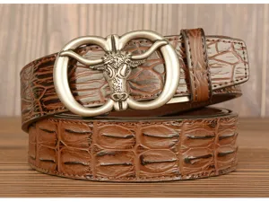 Close-up detail of the retro men's brown leather belt featuring a metallic bull head buckle.