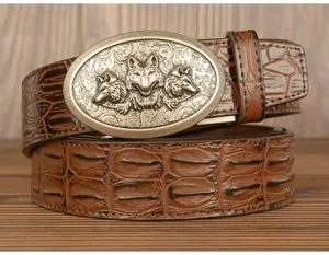 Men vintage leather belt detail, crocodile pattern strap with three wolf head buckle