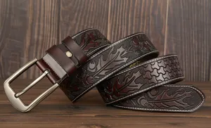 Men's embossed cowhide leather belt with floral carved design, casual jeans belt accessory.