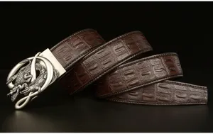 Detailed view of dark brown crocodile pattern men leather belt with metal alligator buckle.