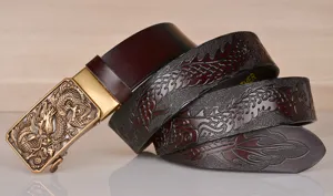 Detailed shot of mens embossed dragon leather belt with metal automatic buckle for jeans.