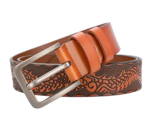 Close-up of men's leather belt detail showcasing vintage embossed dragon pattern and metal buckle.
