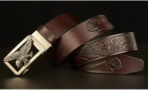 Detailed view of the embossed eagle men's leather belt with metal automatic buckle.