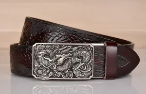 Detailed view of mens leather dragon belt with embossed pattern and silver automatic buckle.