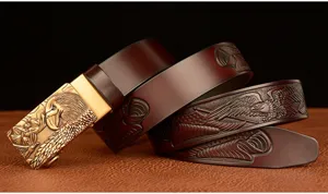 Men's brown leather belt featuring an eagle head automatic buckle and embossed eagle pattern details.