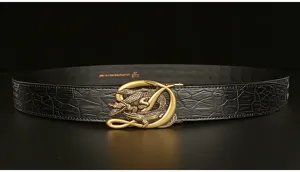 Close-up of luxury men leather belt with golden 3D crocodile buckle and textured grain.
