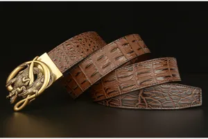 Detailed shot of brown embossed crocodile leather men belt with golden automatic buckle.