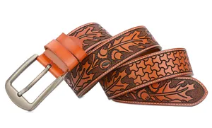 Detailed view of men's genuine leather belt with vintage floral carving and metal buckle.