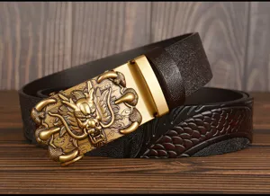 Detailed close-up of men's leather belt with intricate dragon buckle and embossed texture.