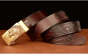 Detailed view of men leather belt with golden eagle buckle and embossed eagle strap.