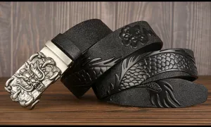 Detailed view of men's leather belt featuring fierce dragon automatic buckle and embossed scales.