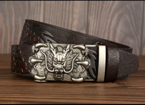 Detailed view of mens leather belt with dragon automatic buckle and embossed texture.
