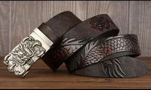 Men's leather belt with dragon buckle detailed close-up, embossed pattern style for men.