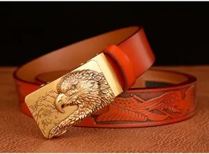 Detailed view of men's leather belt featuring a golden eagle head buckle and embossed strap.