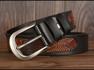 Detailed view of men's leather belt with vintage embossed eagle pattern and metal pin buckle.