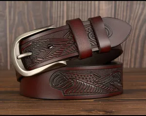 Men's brown leather belt detail, embossed eagle carved design with classic metal pin buckle.