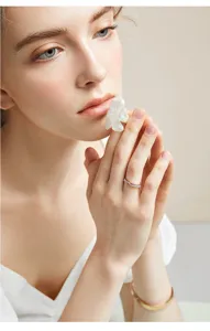 Elegant rose gold titanium steel ring for women with micro-set zircon and pink shell inlay.