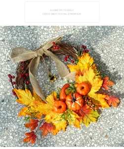 Thanksgiving autumn wreath decoration with maple leaves and pumpkins for holiday party decor.