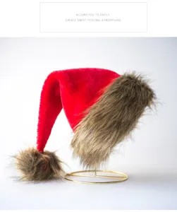 Festive red Santa hat with brown plush faux fur trim and pom-pom for holiday party decor.