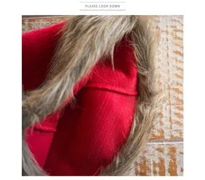 Close-up detail of the red Christmas hat interior and plush faux fur brim texture.
