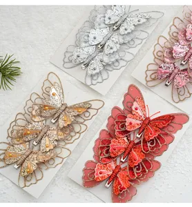 Detalles de pinzas y colgantes de árbol de navidad de mariposa doble con purpurina.