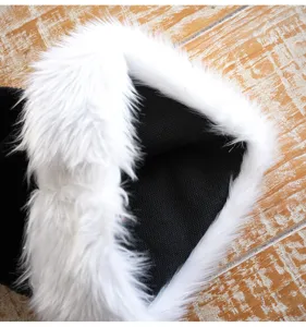 Close-up detail of the black adult Christmas hat with soft white plush brim for holiday decor.