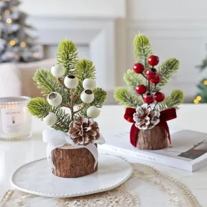 Mini Christmas tree tabletop decoration with wooden base, pine branches and berries for home.