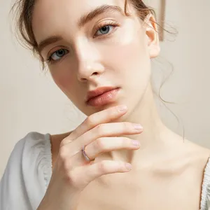 Minimalist rose gold titanium steel ring with micro-set zircon and shell for women daily wear.