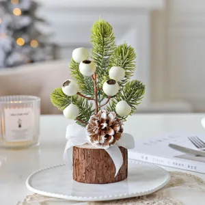 Mini Christmas tree table decoration with natural wooden base and white berry detail