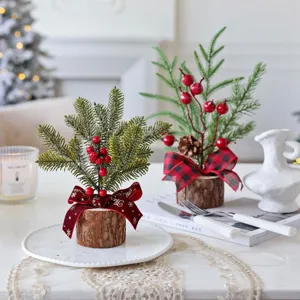Mini artificial Christmas tree table decor with wood base and red berries for holiday decoration