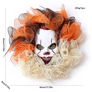 Halloween clown mask wreath with orange and black mesh for front door party decoration.