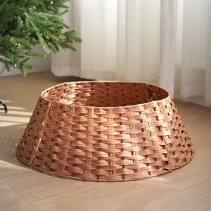 Wicker-look plastic Christmas tree collar detail, showing woven texture and warm home decor.