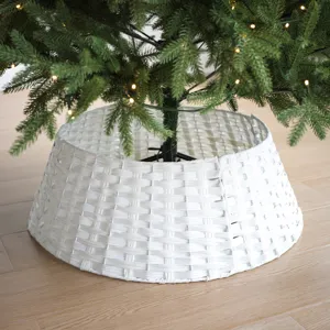 Detailed white plastic woven Christmas tree collar, minimalist decorative tree skirt base.