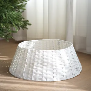 White plastic rattan Christmas tree collar, minimalist woven tree base basket for holiday decor.