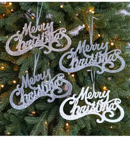 Close-up detail view of sparkling glitter Merry Christmas hanging tree ornaments.