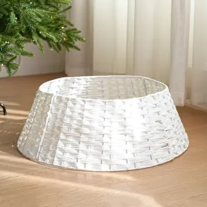 Detailed view of white plastic wicker Christmas tree collar base for holiday home decor.