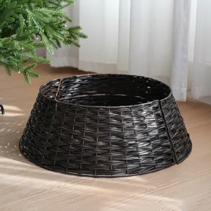 Detailed view of dark brown plastic rattan Christmas tree collar, minimalist woven tree skirt.