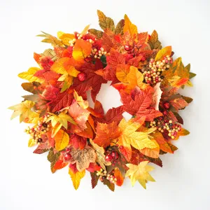 Artificial autumn maple leaf wreath with colorful berries for front door home decor.