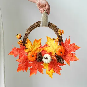 Autumn maple leaf wreath with pumpkins and pinecones for Thanksgiving and Halloween decor.