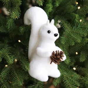 White flocked squirrel Christmas tree ornament holding a pine cone holiday hanging decor.