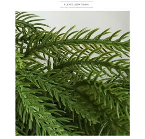Norfolk pine needle detail shot, realistic PE artificial plant foliage for festive decor.