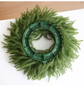 Norfolk pine Christmas wreath detail showing soft touch plastic pine needles and frame.
