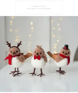 Detail shot of cute plush bird ornaments with scarves and hats for festive holiday decor.