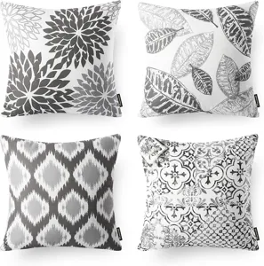 Set of four black and white throw pillow covers featuring abstract floral, leaf, and geometric patterns.