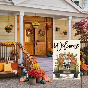 Autumn garden flag displayed on porch, featuring vintage truck and pumpkin print detail.