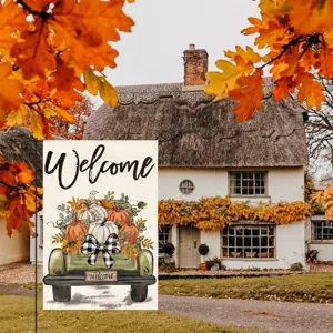 Fall garden flag detail featuring cute autumn truck and pumpkins decor for outdoor yard setup.