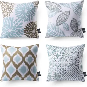Detailed view of four decorative throw pillow covers featuring floral, leaf, geometric and tile patterns.