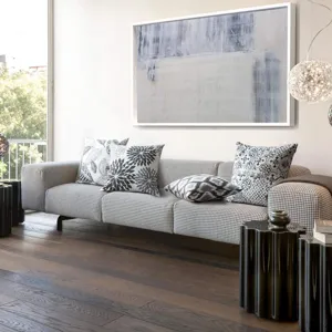 Modern geometric and floral throw pillow covers detail in a stylish living room setting.